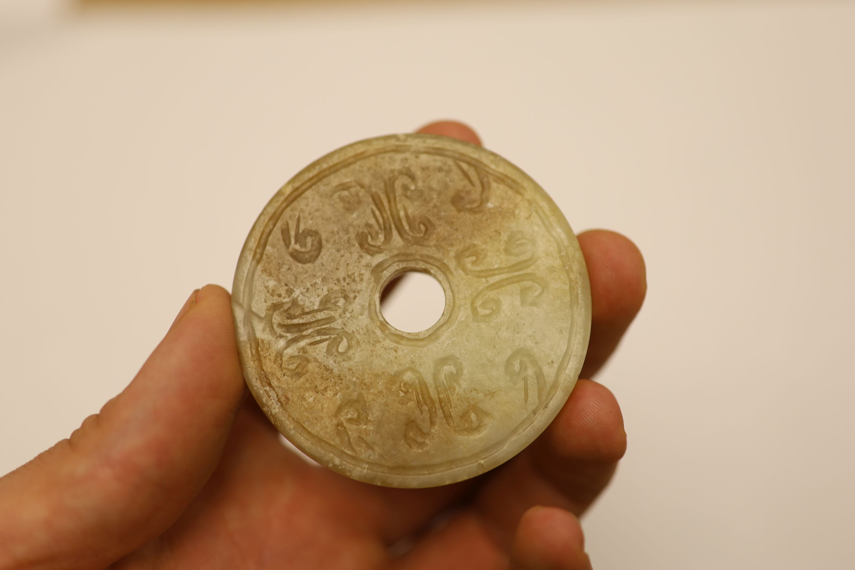 A quantity of assorted jade bi discs and other hardstones